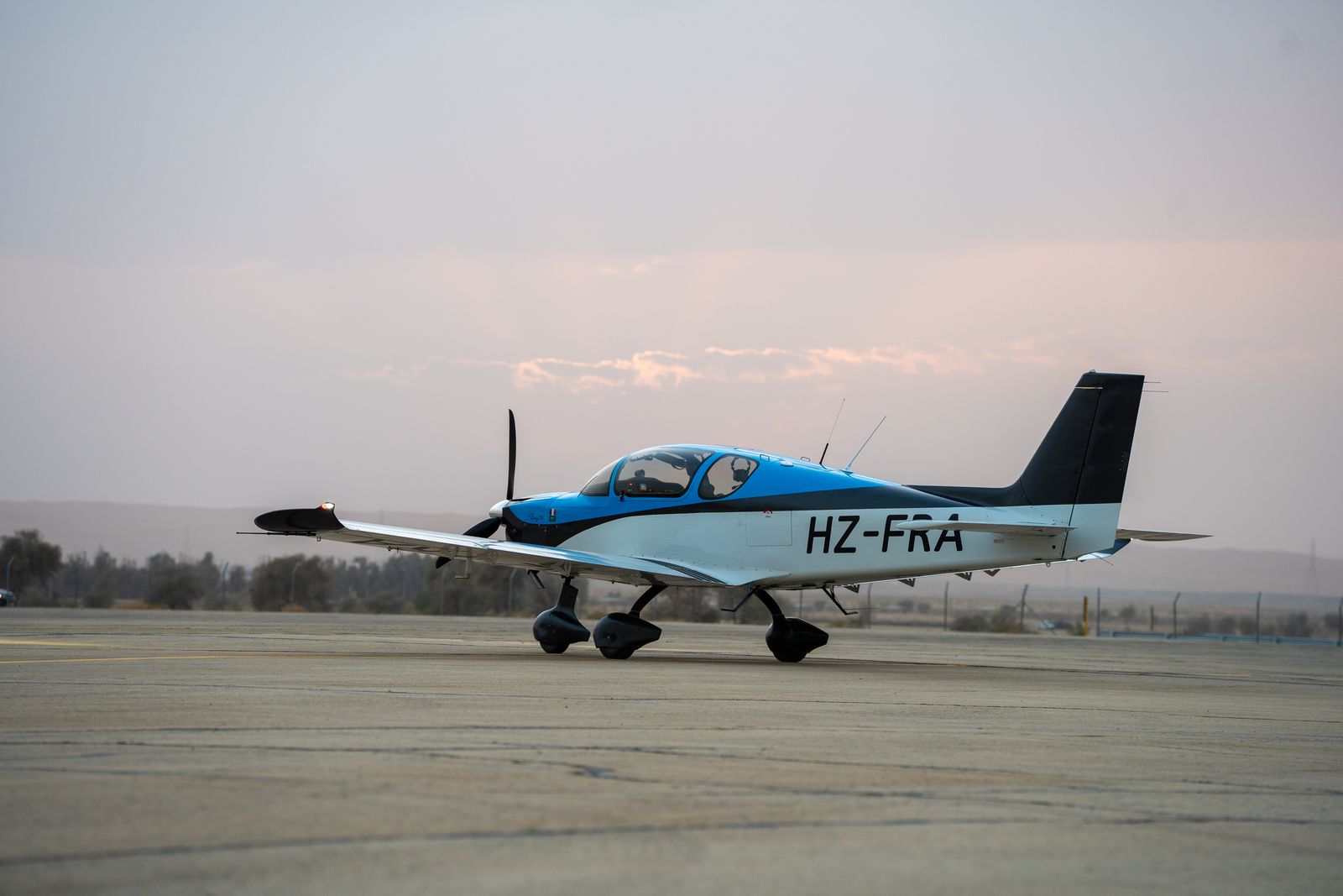 Sling TSi HZ-FRA, built in Saudi Arabia, taxiing at dusk (side view)