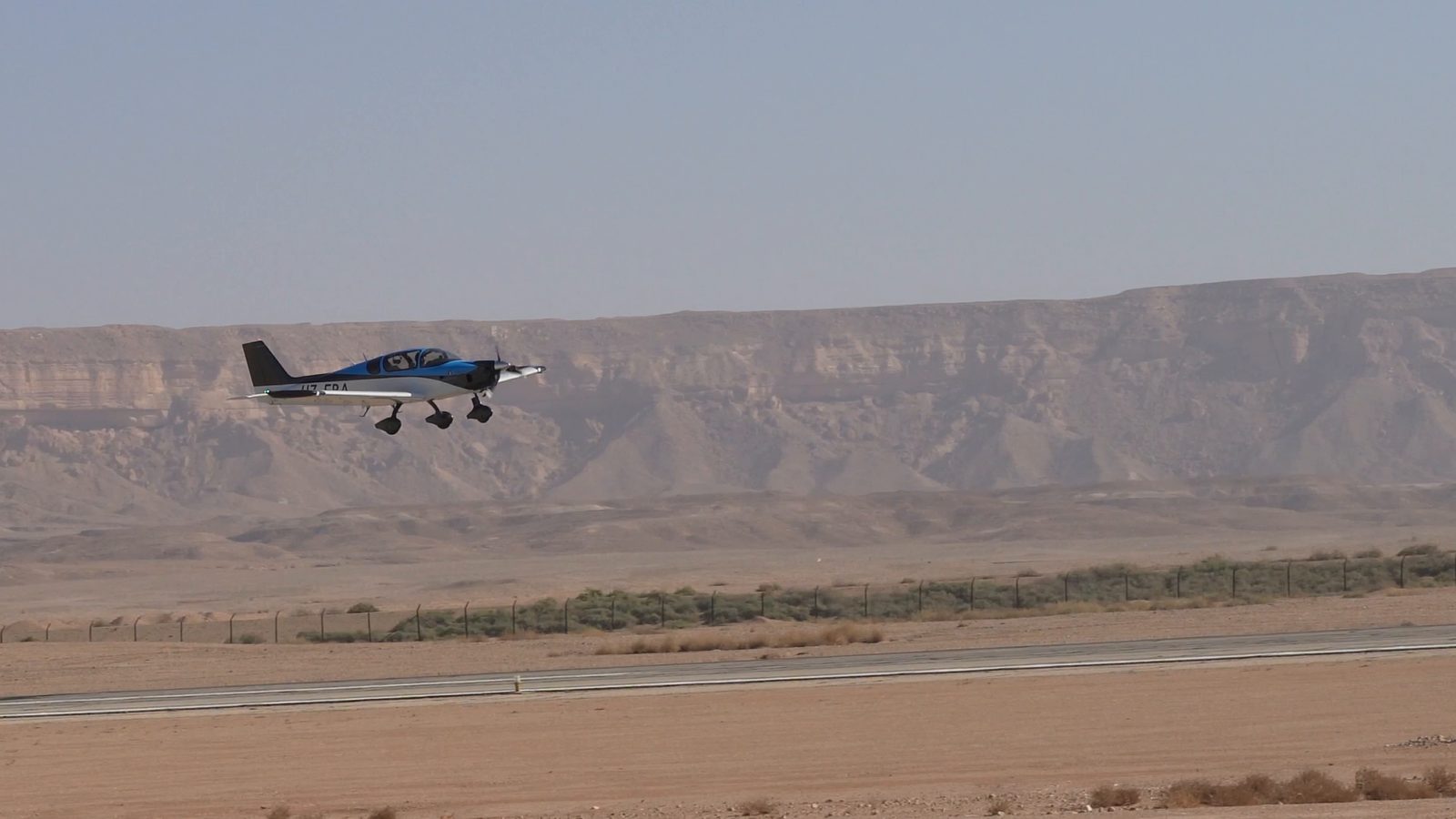 HZ-FRA lifting off on its maiden flight, 8 November 2024, with the desert escarpment behind